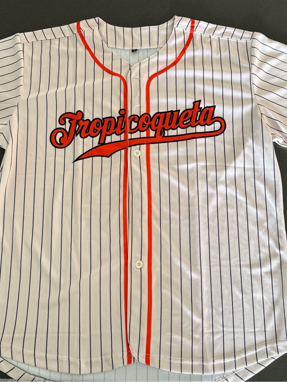 Women’s/ Men's White Pinstripe Baseball Shirt with Orange Trim. Karol G
